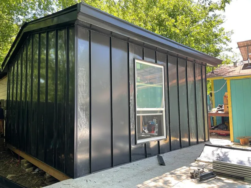 Black standing seam metal wall panels for Roof Inspection in Prairie View