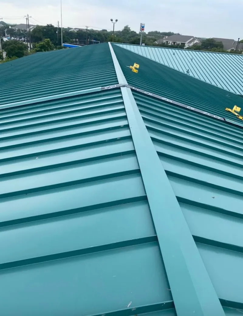 Green commercial metal roof ridge and valley for Metal Roof Repair in Prairie View