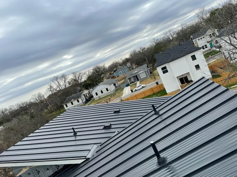 Standing seam metal roof panels with vents for Skylight Repair in Prairie View